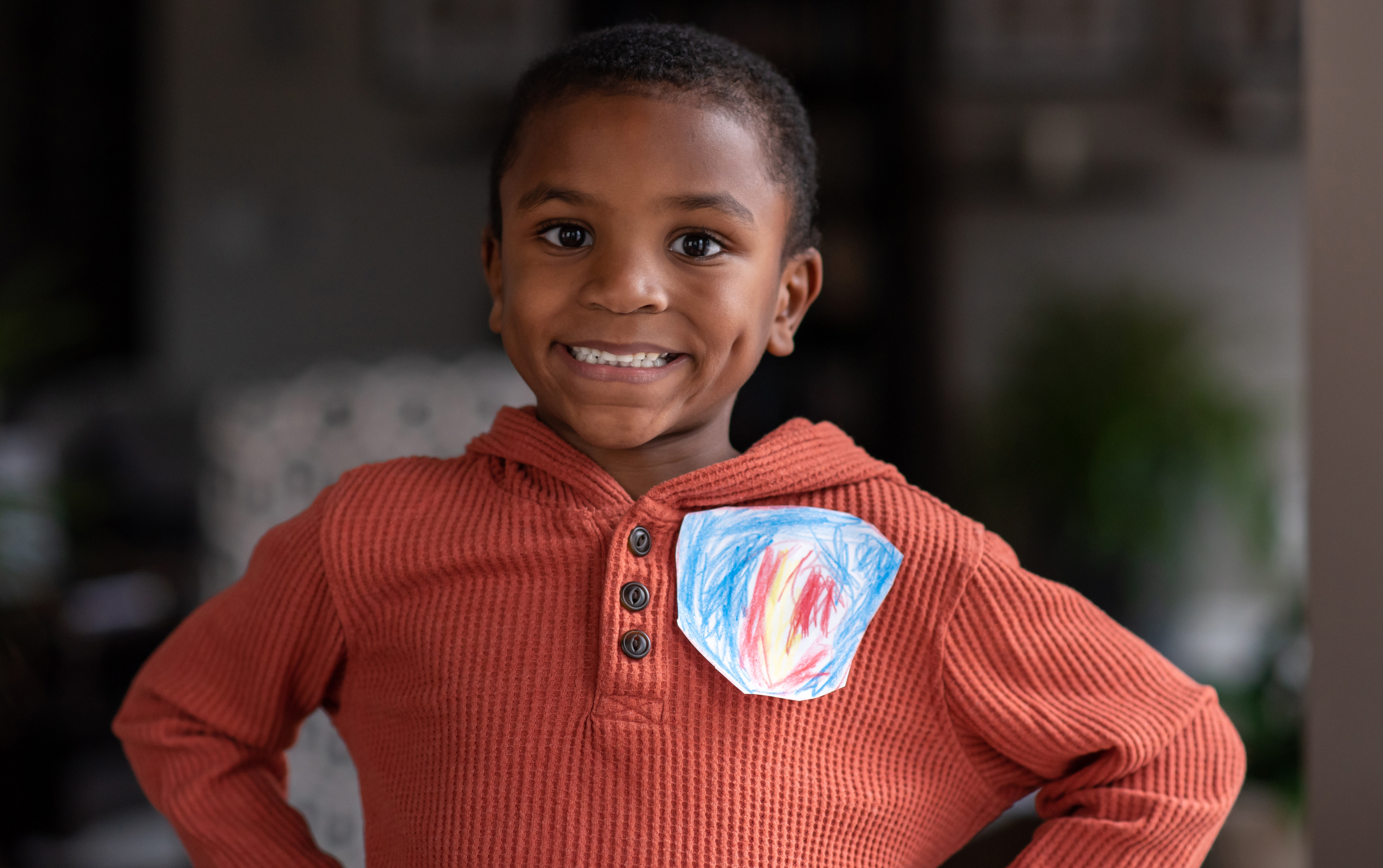 Young boy proudly wears his courage badge.