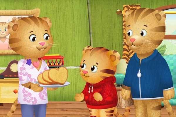 Mom Tiger offer Daniel and Dad Tiger some heart shaped banana bread.
