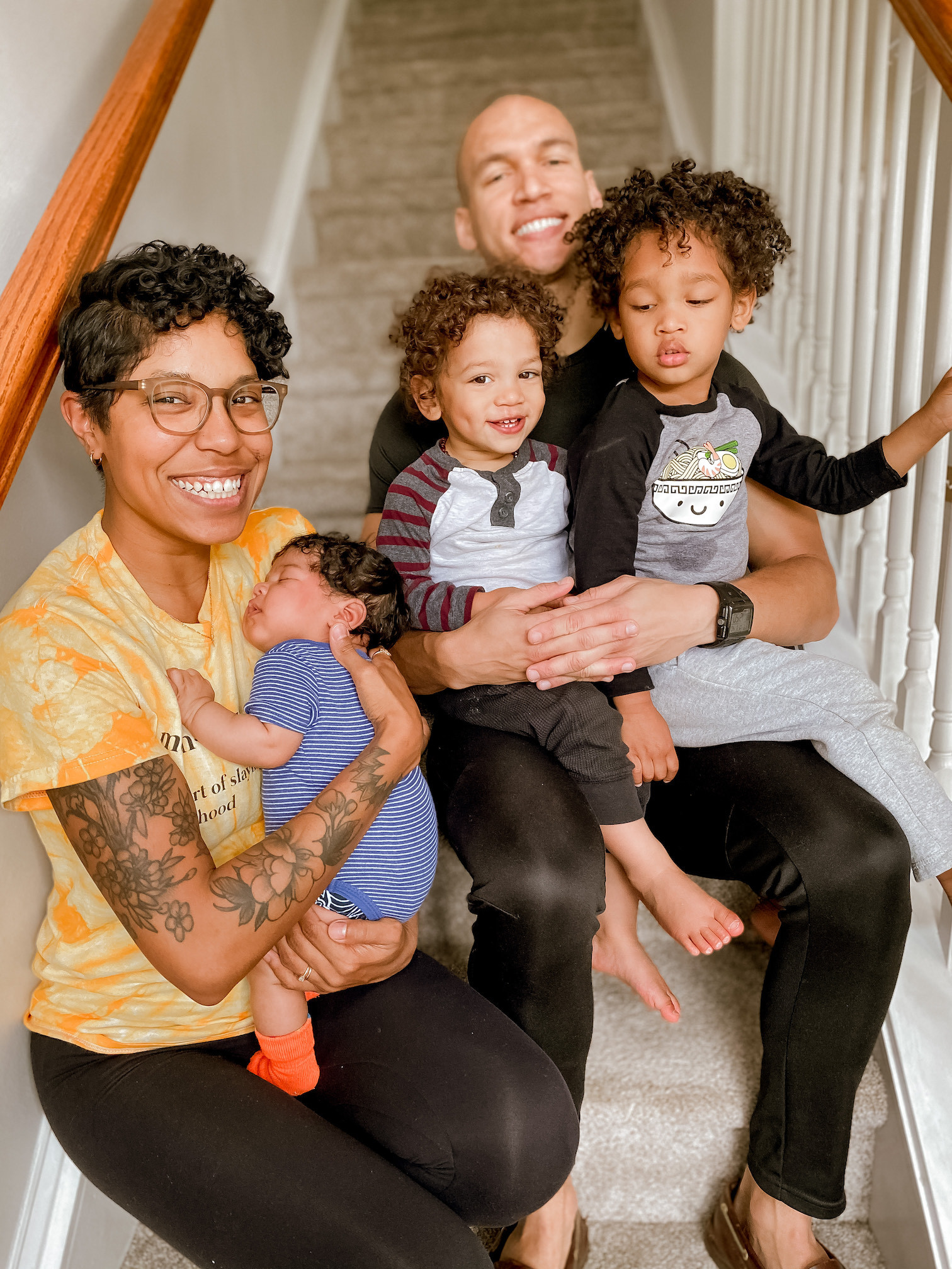 Image of family sitting on steps.